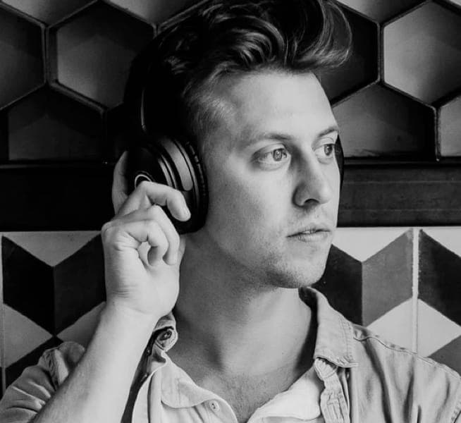 A person wearing audiophile's headphones